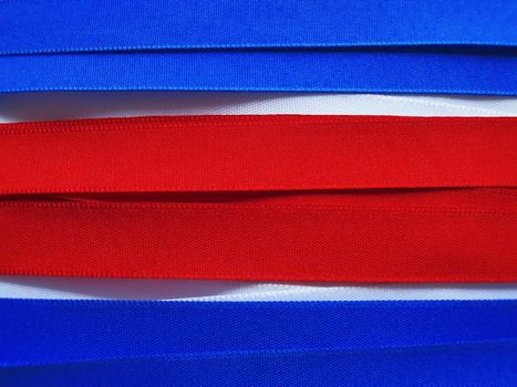 North Korea flag or banner made with red, blue and white ribbons