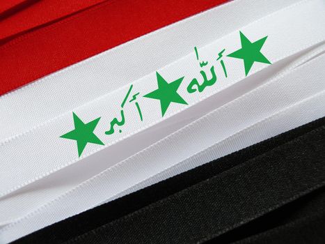 Iraq flag or banner made with red, white and black ribbons