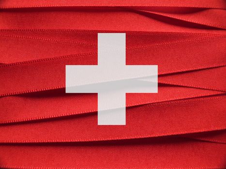 Switzerland flag or banner made with red and white ribbons