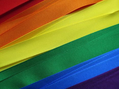 Gay Flag flag or banner made with red, orange, yellow, green, blue and purple ribbons