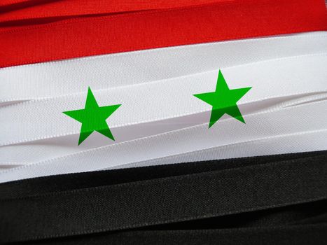 Syria flag or banner made with red, white and black ribbons