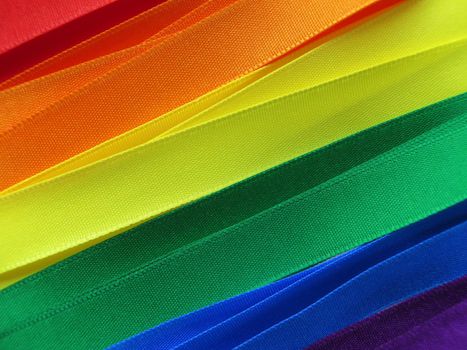 Gay Flag flag or banner made with red, orange, yellow, green, blue and purple ribbons