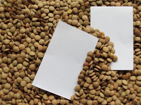 White tag on Heap of raw lentils background