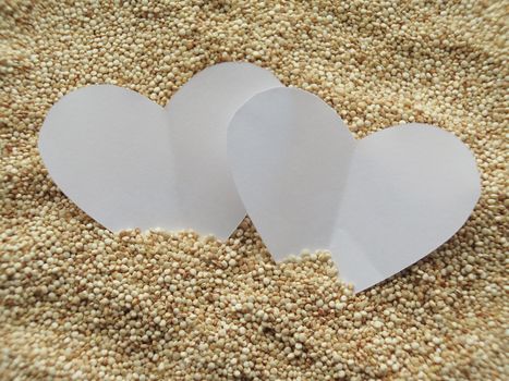 Heart shape on raw cous cous semolina background