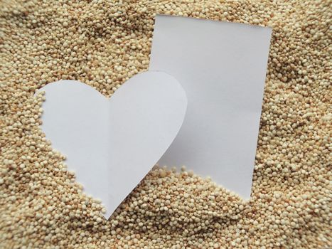 Heart shape on raw cous cous semolina background