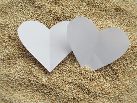 Heart shape on raw cous cous semolina background