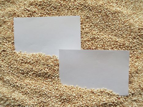 White paper on raw cous cous semolina background