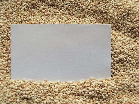 White paper on raw cous cous semolina background