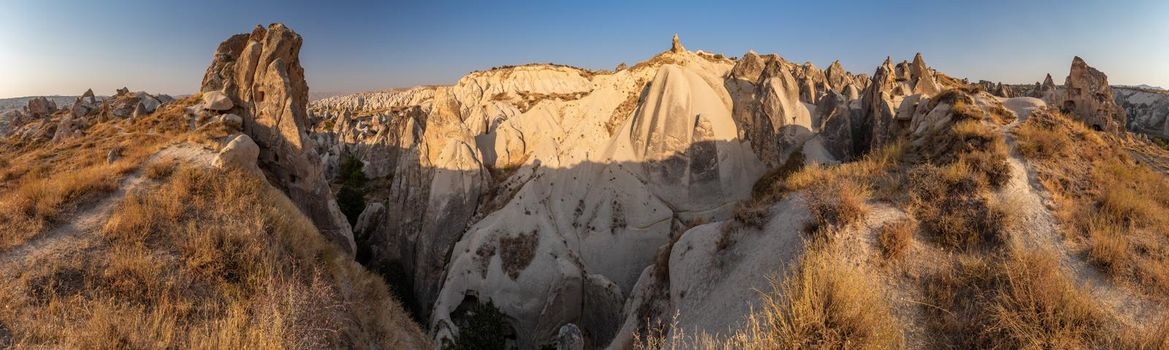 The picturesque panorama of Cappadocia at sunset, amazing Turkey, Mountains and rock formation, big size image, Goreme national park, Love valley, open air museum, ancient region of Anatolia, Unesco. High quality photo