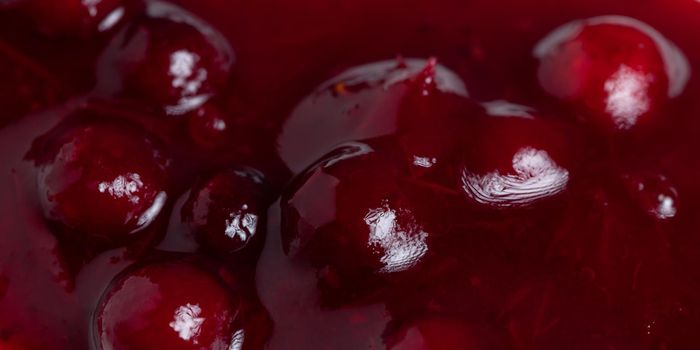 Fresh ripe lingonberry sauce close-up. Food background, texture.