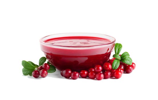 Homemade fresh wild lingonberry sauce in small glass bowl isolated on white background.
