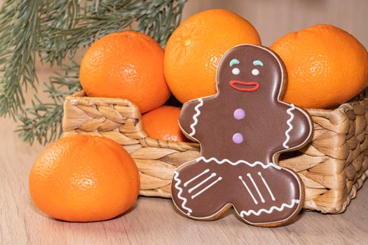 ginger cookies. tangerines in the basket. spruce branch. High quality photo
