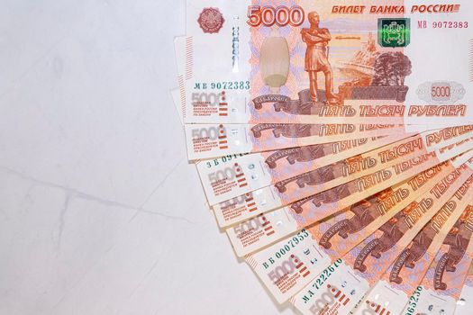 Russian ruble bills laid out on the marble in close-up. High quality photo