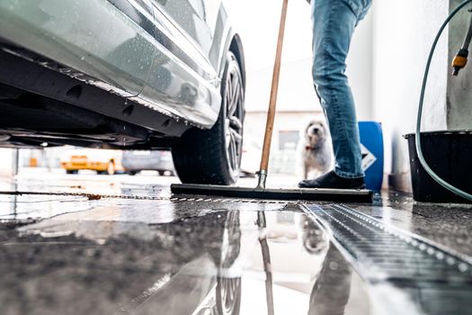 cleaning the floor after washing the car in the dishwasher.