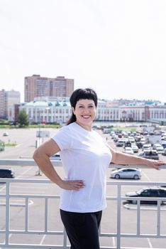 Sport and fitness. Senior sport. Active seniors. Smiling senior woman working out outdoors on urban background