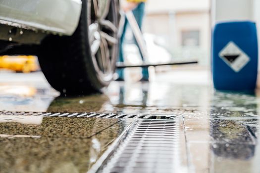 cleaning the floor after washing the car in the dishwasher.