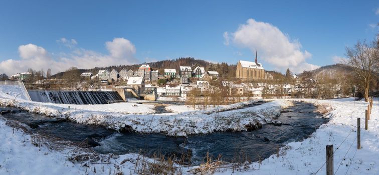 Panoramic image of Beyenburg close to Wuppertal on a winter day with snow covered landscape, Bergisches Land, Germany