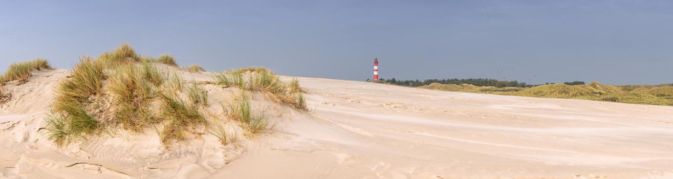 Panoramic image of the dunes of Amrum with the lighthouse, Germany