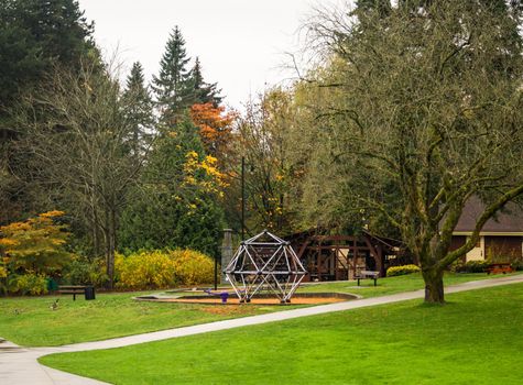 Small playground in a park on overcast autumn day. Fall season in Canada