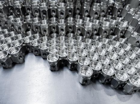 shiny steel industrial production parts after turning - close-up with selective focus