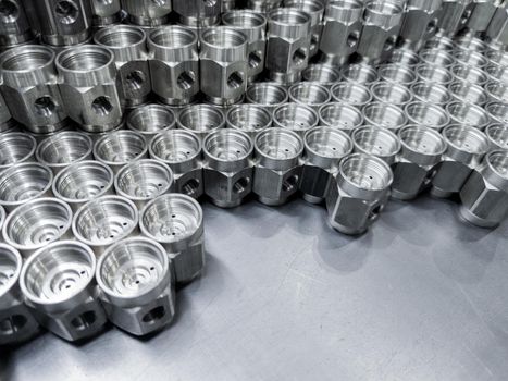 shiny machined metal parts - close-up industrial background with selective focus