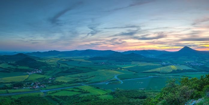 View from Lovos Hill. Sunset  in Central Bohemian Highlands, Czech Republic. Central Bohemian Uplands  is a mountain range located in northern Bohemia. The range is about 80 km long.