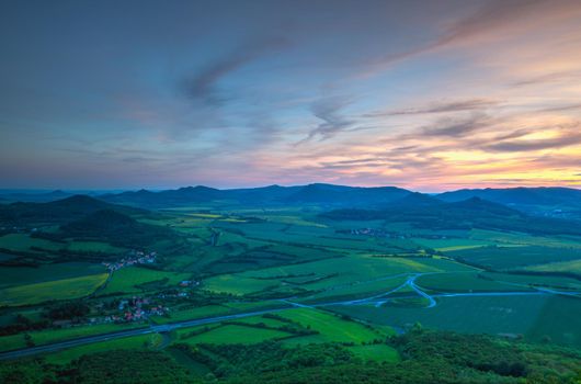 View from Lovos Hill. Sunset  in Central Bohemian Highlands, Czech Republic. Central Bohemian Uplands  is a mountain range located in northern Bohemia. The range is about 80 km long.