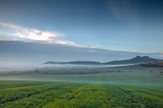 Landscape covered with fog in Central Bohemian Uplands, Czech Republic. Central Bohemian Uplands is a mountain range located in northern Bohemia. The range is about 80 km long