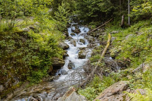 Small stony waterfall next to mountain trail in Giant Mountains