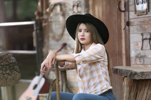 Beautiful young women sitting in natural field and rural background.