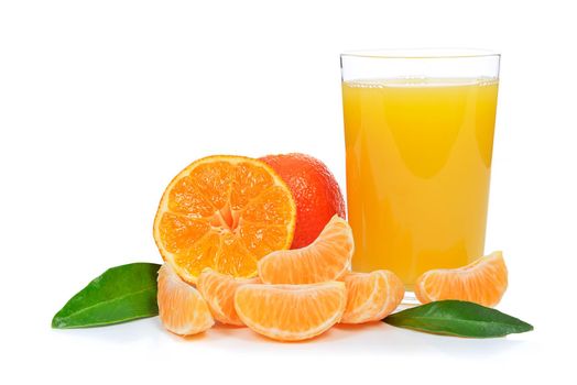Tropical fruit composition - glass of fresh orange juice and pieces of orange or tangerine isolated on a white background