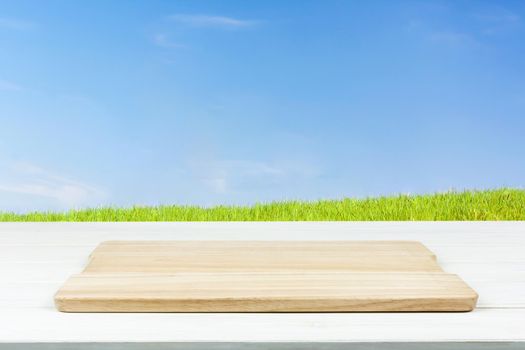 Mock-up of organic outdoor cooking or product presentation- empty wooden plank on the table (mixed)