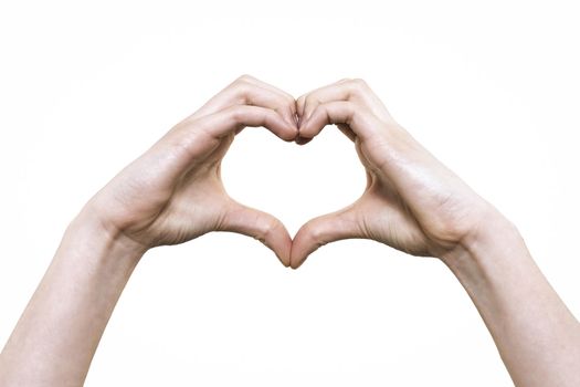 Woman hands make heart sign on the white background