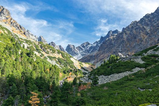 Majestic view of National Park High Tatras Mountains in Popradske Pleso, Slovakia on a sunny autumn day ( below Sedlo pod Ostrvou)