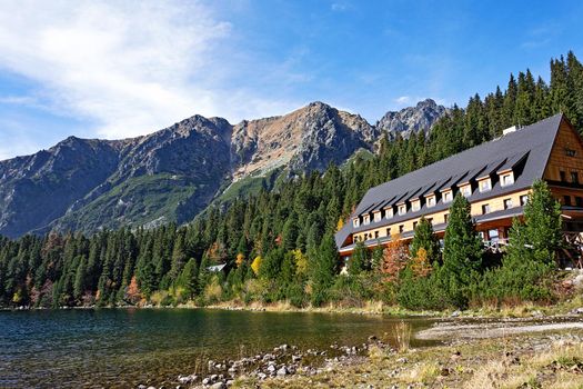 Popradske Pleso, Slovakia - October 15, 2017:  View of Tourist Shelter and lake in Popradske Pleso, National Park High Tatras Mountains in Slovakia on a sunny autumn day.