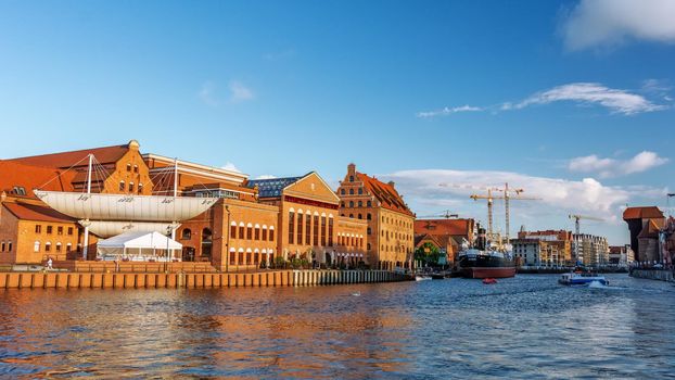 Gdansk, Poland - June 26, 2018: Panoramic view of the old city of Gdansk on the Motlawa River and famous The Polish Baltic Philharmonic.