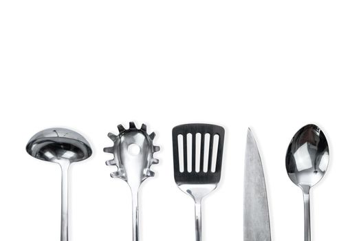 Top view of a silver kitchen utensil collection isolated on white background with copy space