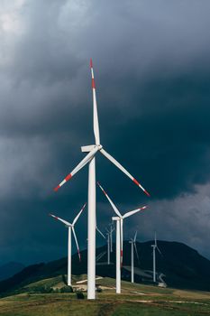 High wind turbines against the lead sky. High quality photo