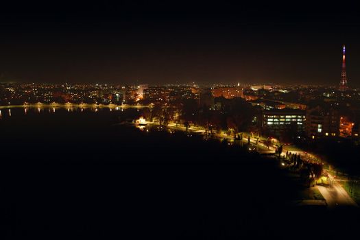 Panoramic night view of city with beautiful lights and incredible building. Concept of beautiful view building and lighted road at night.