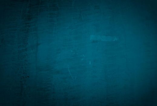 Vintage grunge blue concrete texture studio wall background with vignette