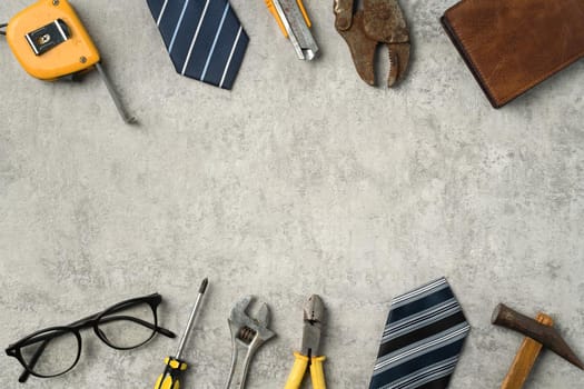 Top view design concept of Father's day and labor day with working tools on blue background.