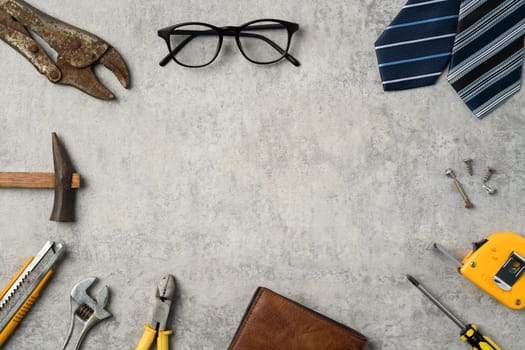 Top view design concept of Father's day and labor day with working tools on blue background.