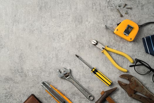 Top view design concept of Father's day and labor day with working tools on blue background.