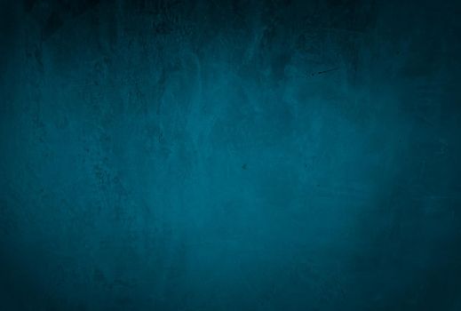 Vintage grunge blue concrete texture studio wall background with vignette