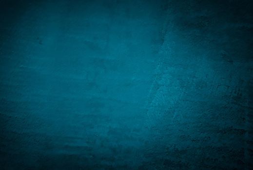 Vintage grunge blue concrete texture studio wall background with vignette