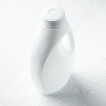 Laundry with white plastic bottle set, on white stone surface, square format