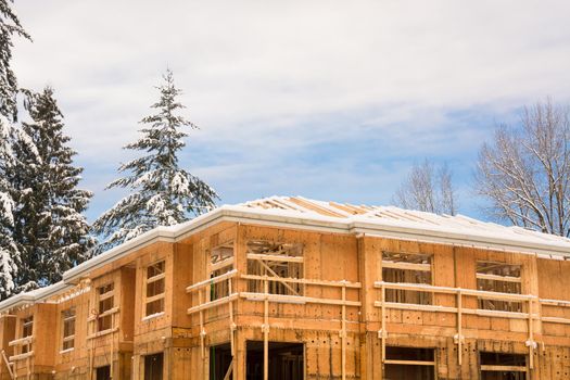 Fragment of townhome complex under construction on winter time
