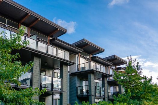 Top of residential building on blue sky background