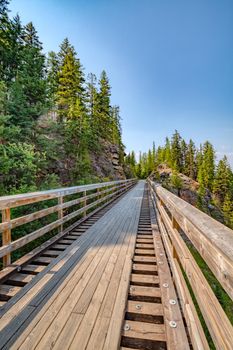 Bike trail over old railroad bridge over Myra canyon in Okanagan valley.