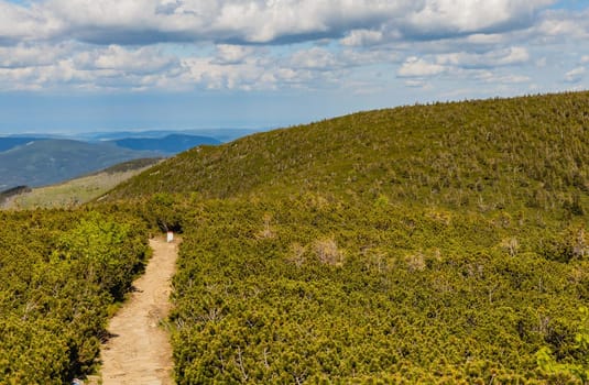 Long mountain trail with panorama if Karkonosze Giant Mountains around